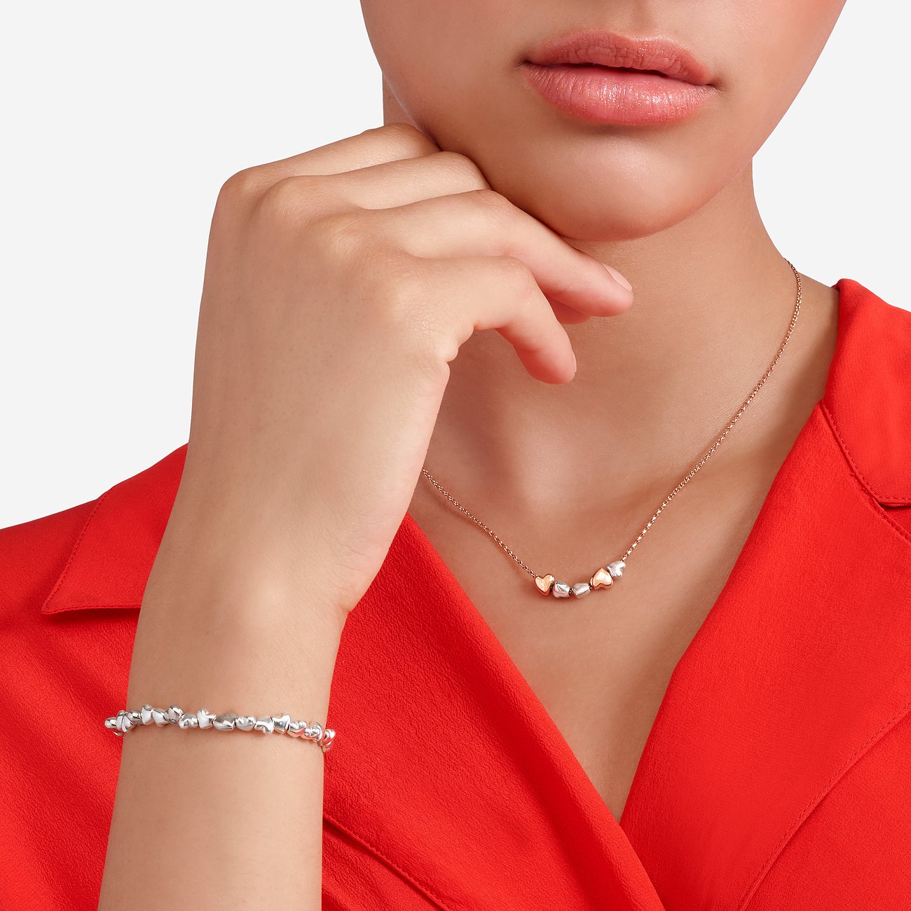 DoDo halsketting van 375 roségoud en 925 zilver met hartvormige hangers.