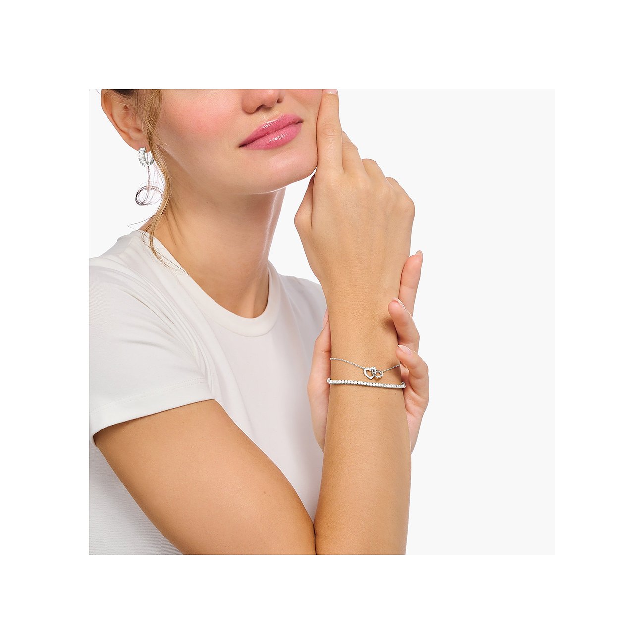 Thomas Sabo Armband aus 925er Silber mit Zirkonia und zwei Herzen.