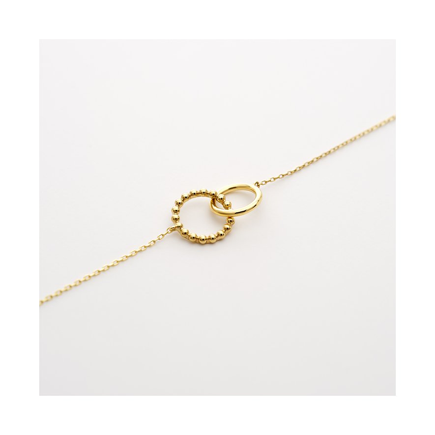 CHRIST armband i 585 gult guld med två sammanflätade ringar, varav den ena är prydd med små kulor.