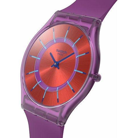 Montre unisexe Swatch avec boîtier en plastique, cadran rouge et aiguilles bleues.