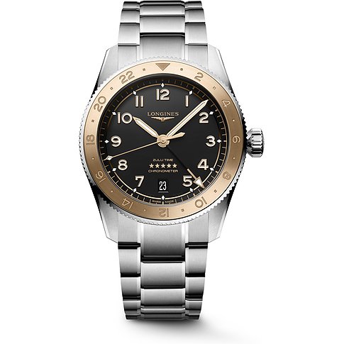 Longines Zulu Time mit Edelstahlgehäuse und Gelbgold-Lünette, analog.