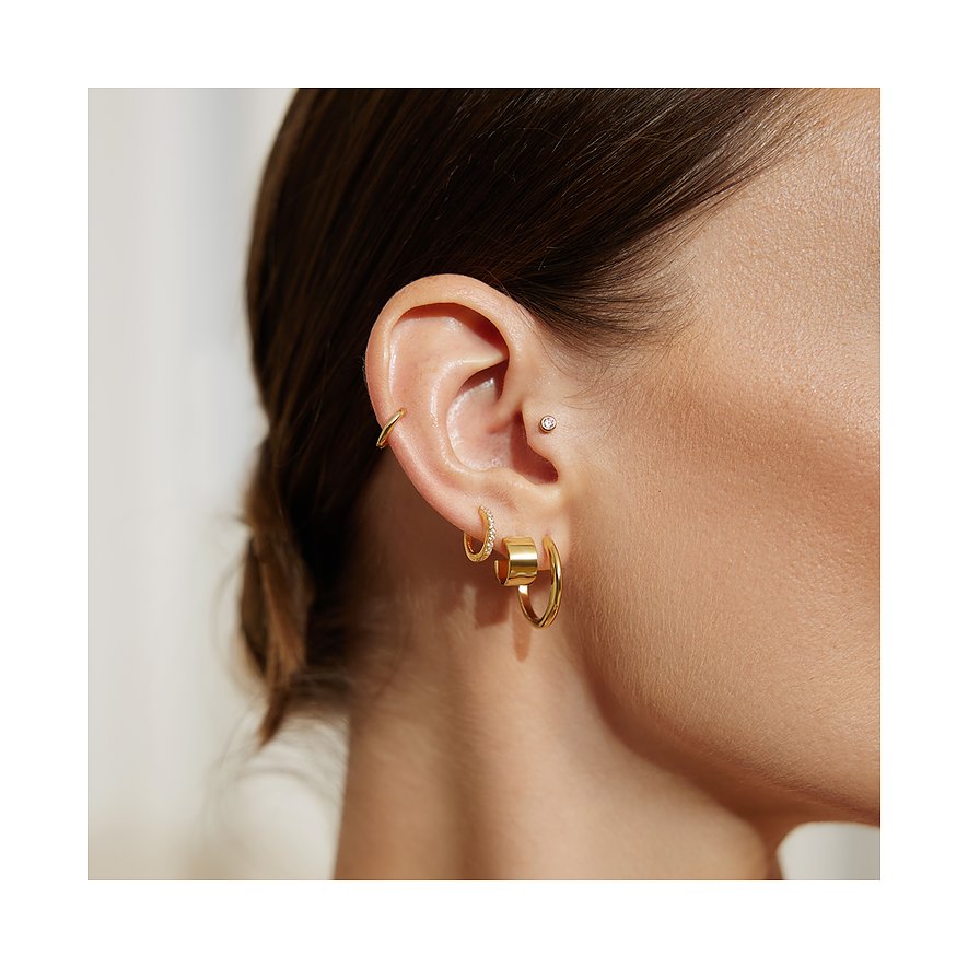 Ania Haie örhängen i 925 silver, med stenar och en bred ring.