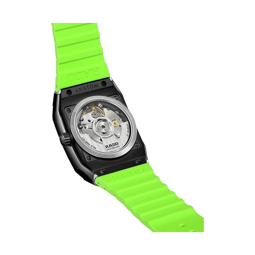 Rado Unisexuhr aus Keramik mit schwarzem Gehäuse und leuchtend grünem Armband, Rückansicht zeigt das mechanische Uhrwerk.