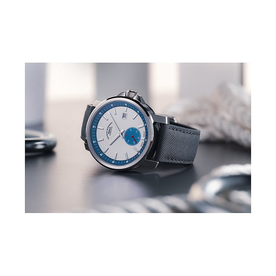 Mühle-Glashütte Herrenuhr mit Edelstahlgehäuse, weißem Zifferblatt und blauer Lünette.
