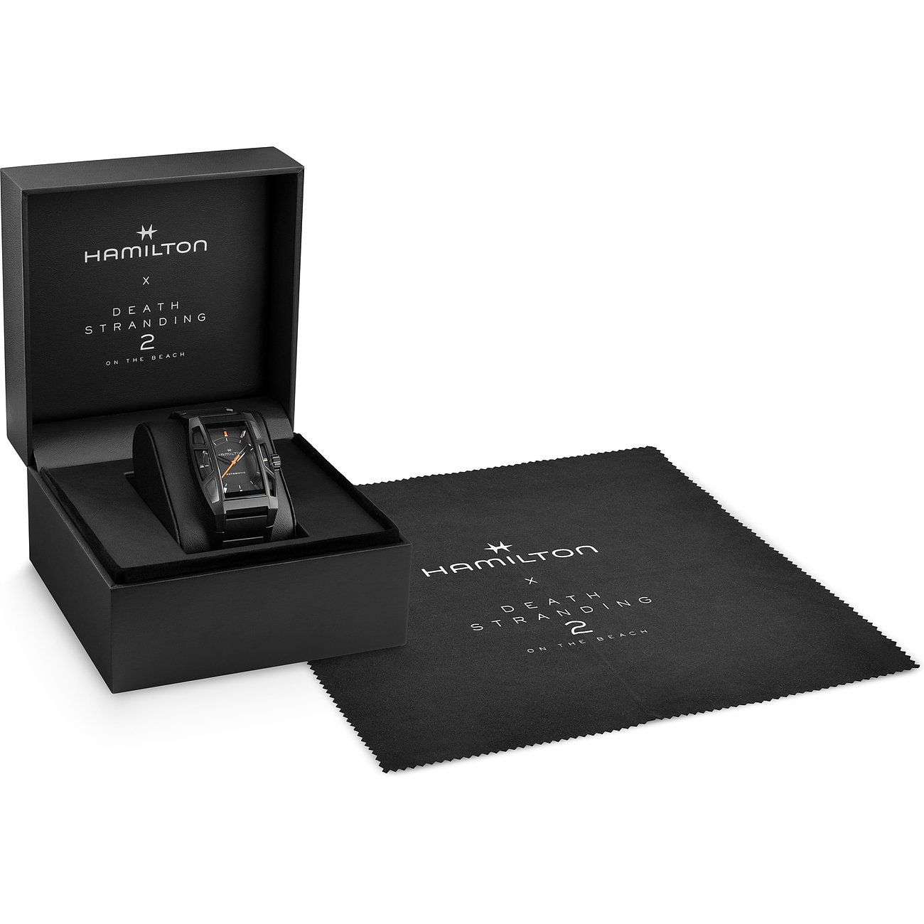 Eine Hamilton Unisexuhr aus Titan in einer schwarzen Box mit einem Mikrofasertuch daneben.
