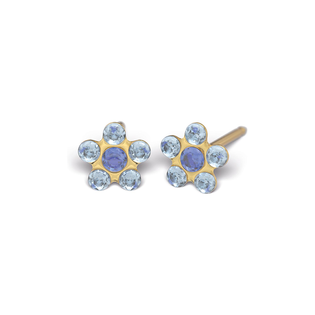 Zwei goldfarbene Studex Ohrstecker aus Chirurgenstahl in Blütenform mit blauen und lila Schmucksteinen.