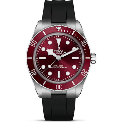 Tudor Herrenuhr mit Edelstahlgehäuse, rotem Zifferblatt und roter Lünette.