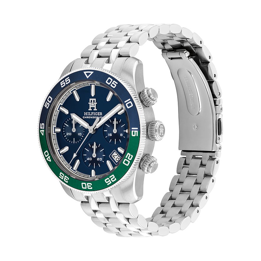 Tommy Hilfiger Herrenuhr aus Edelstahl mit blauem Zifferblatt und grün-blauer Lünette in Seitenansicht.