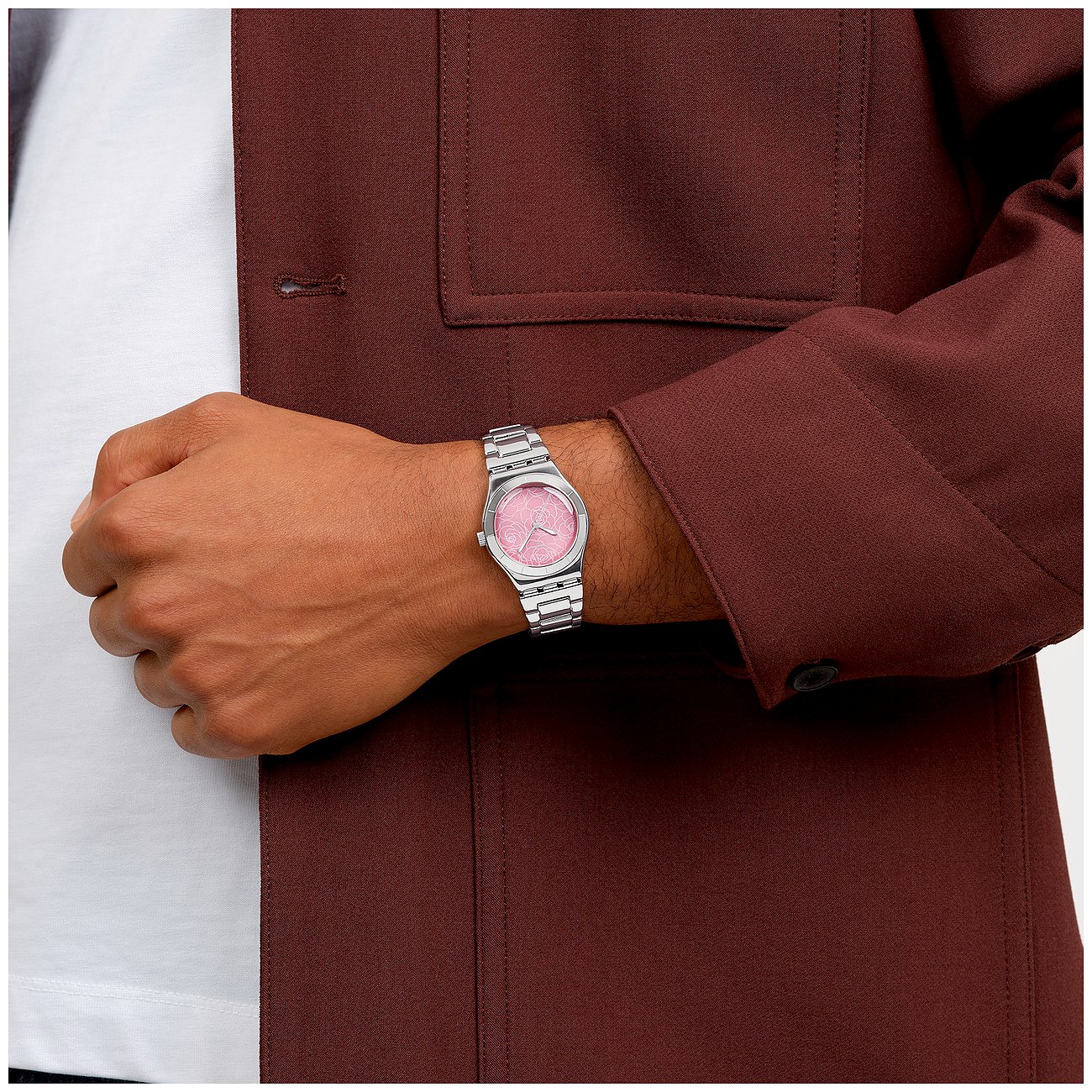 Swatch Damenuhr mit Edelstahlgehäuse und pinkem Zifferblatt.