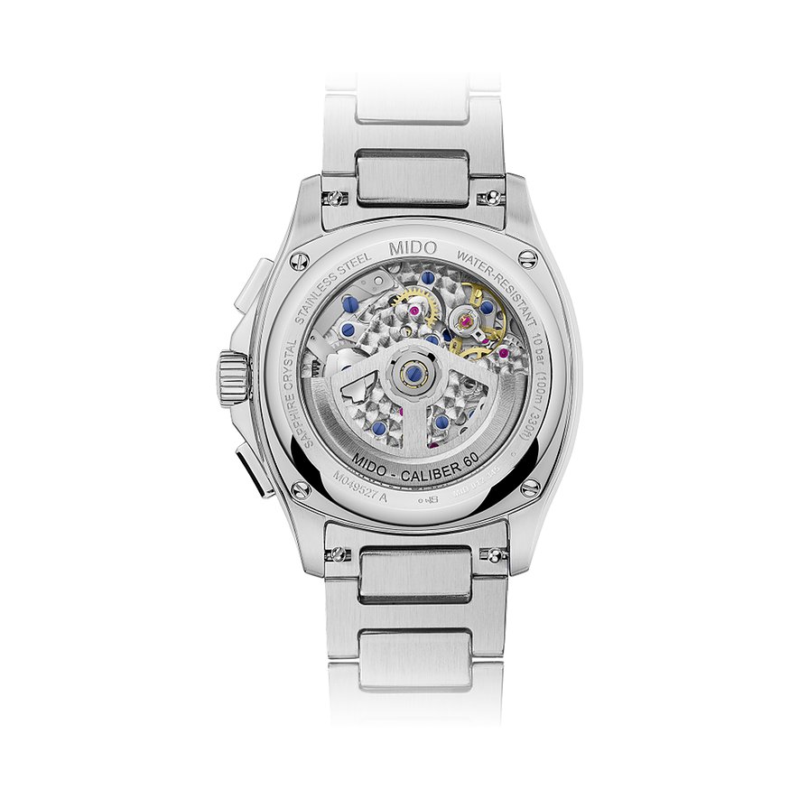 Rückseite einer Mido Herrenuhr aus Edelstahl mit sichtbarem Uhrwerk und Beschriftungen.