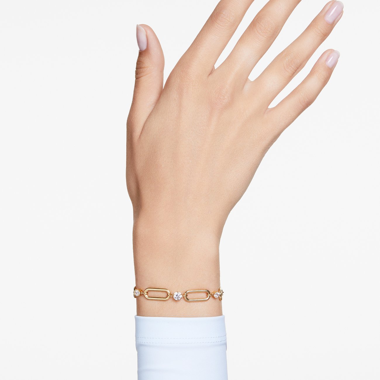 Swarovski polsband, gouden schakelarmband van metaal met fonkelende Swarovski-kristallen.