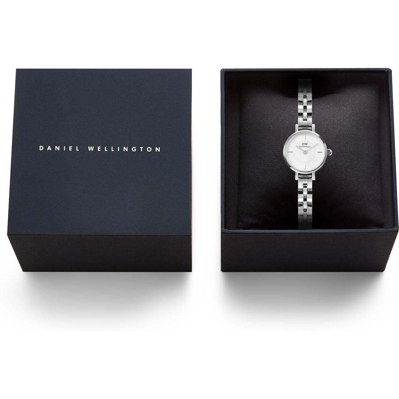 Daniel Wellington Damenuhr aus Edelstahl mit weißem Zifferblatt in offener Uhrenbox, neben geschlossener Box.