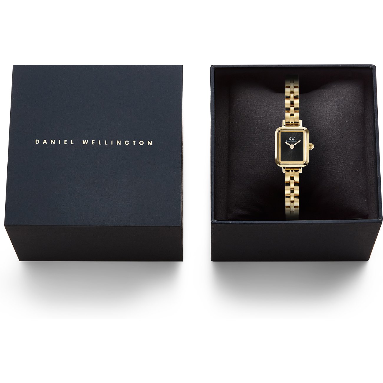 Daniel Wellington Damenuhr aus goldfarbenem Edelstahl mit schwarzem Zifferblatt in offener schwarzer Box.
