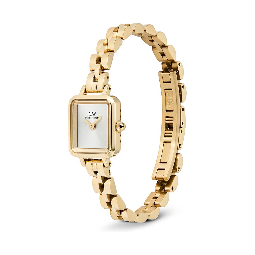 Die Daniel Wellington Damenuhr aus goldfarbenem Edelstahl mit eckigem Zifferblatt wird von oben links gezeigt.