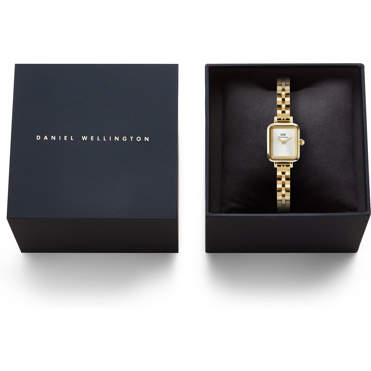 Goldene Daniel Wellington Damenuhr aus Edelstahl in schwarzer Box, daneben der Deckel mit Markenlogo.