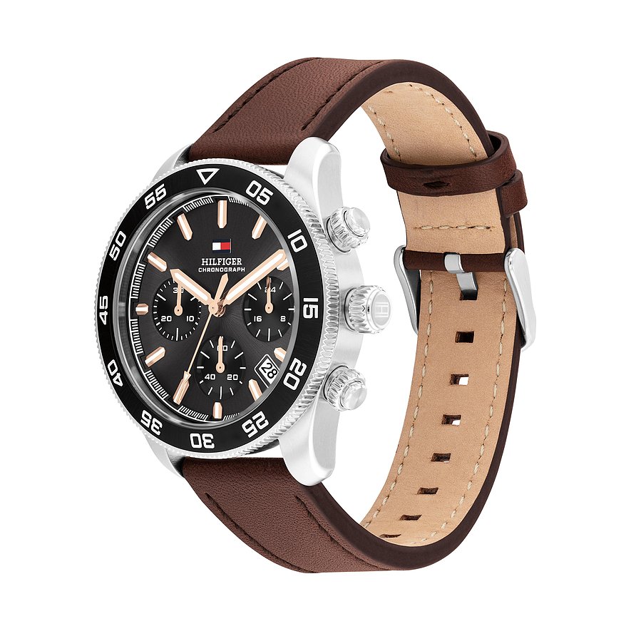Tommy Hilfiger Herrenuhr aus Edelstahl und Aluminium, mit braunem Lederarmband und schwarzem Zifferblatt.
