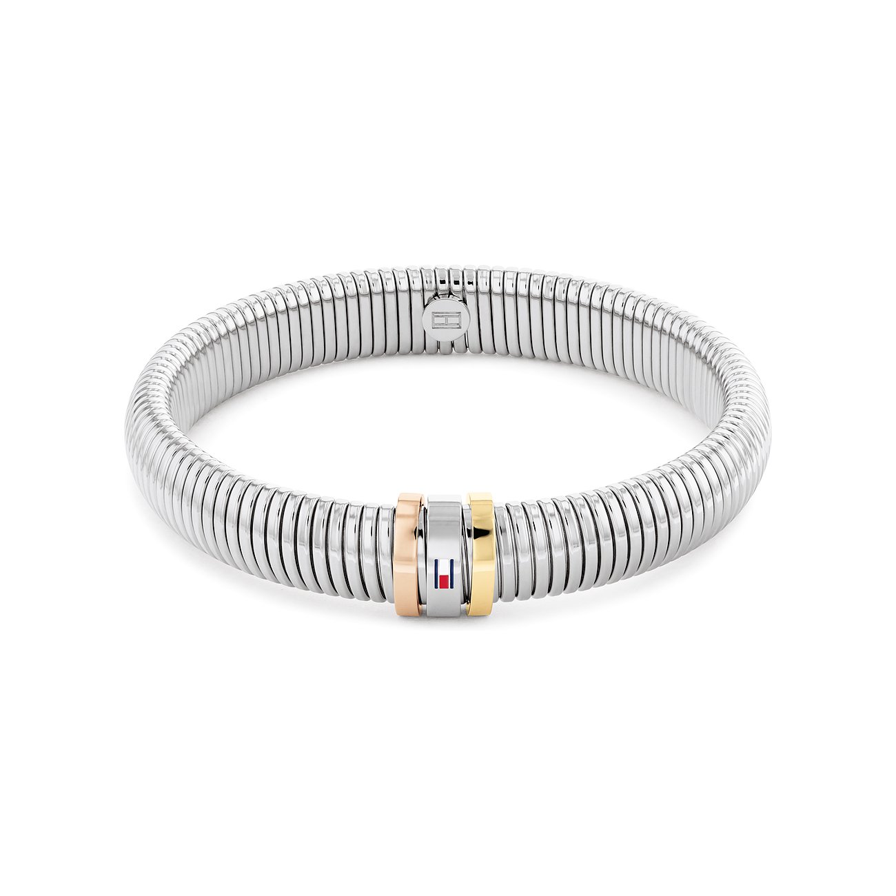 Tommy Hilfiger Armreif aus Edelstahl mit flexibler Gliederung und drei Ringen in Roségold, Silber und Gold.