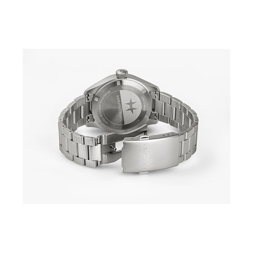 Rückseite einer Hamilton Herrenuhr aus silberfarbenem Edelstahl mit eingraviertem Markenlogo und Seriennummer.