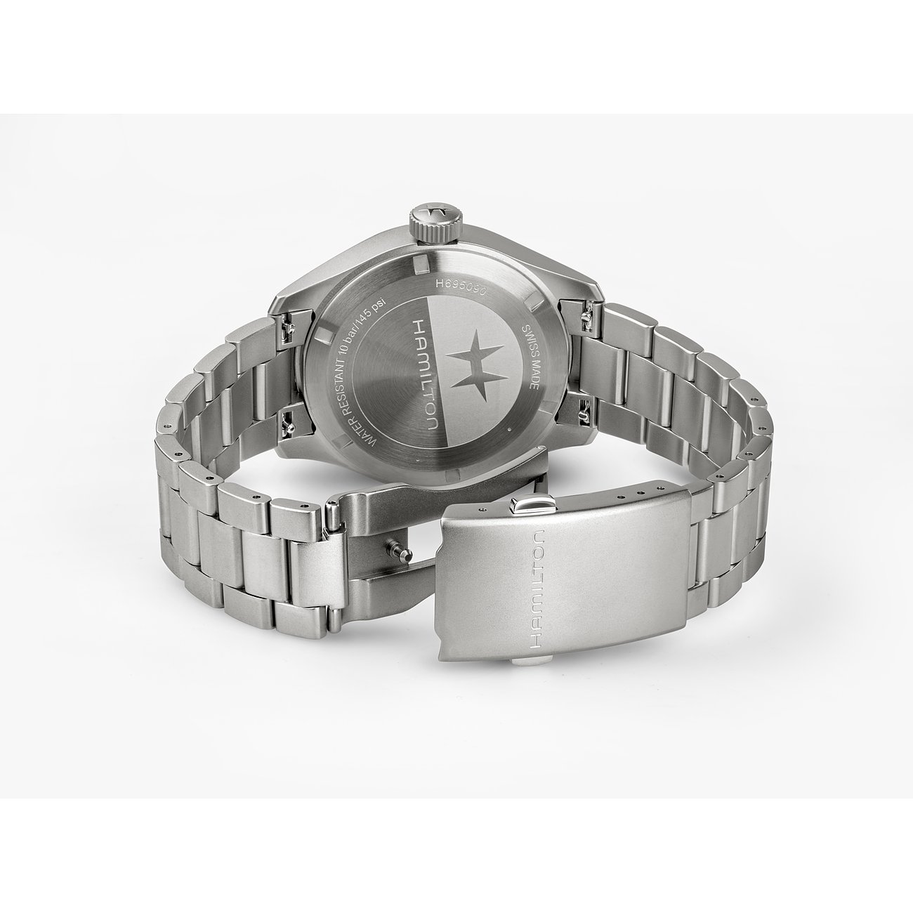 Rückseite einer Hamilton Herrenuhr aus silberfarbenem Edelstahl mit eingraviertem Markenlogo und Seriennummer.