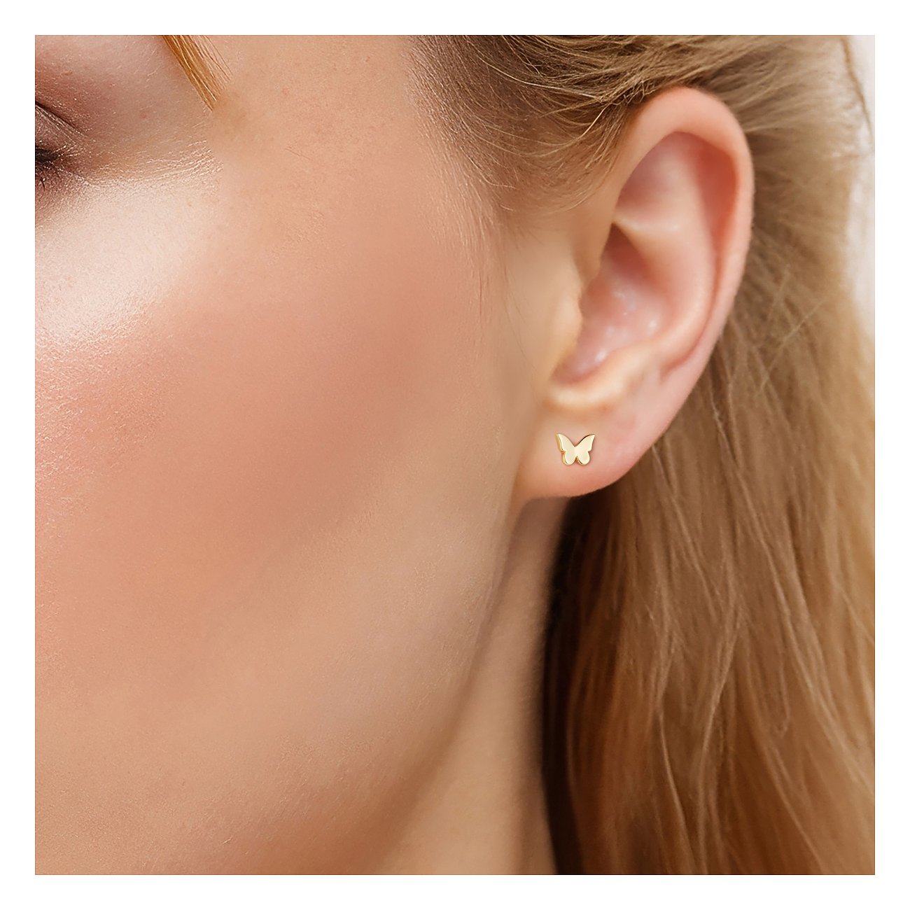 Puce d'oreille papillon Glanzstücke München, portée à l'oreille, en argent 925.