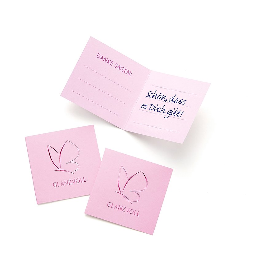 Due carte quadrate rosa con logo e una carta rosa aperta con testo blu: „Schön dass es Dich gibt!“