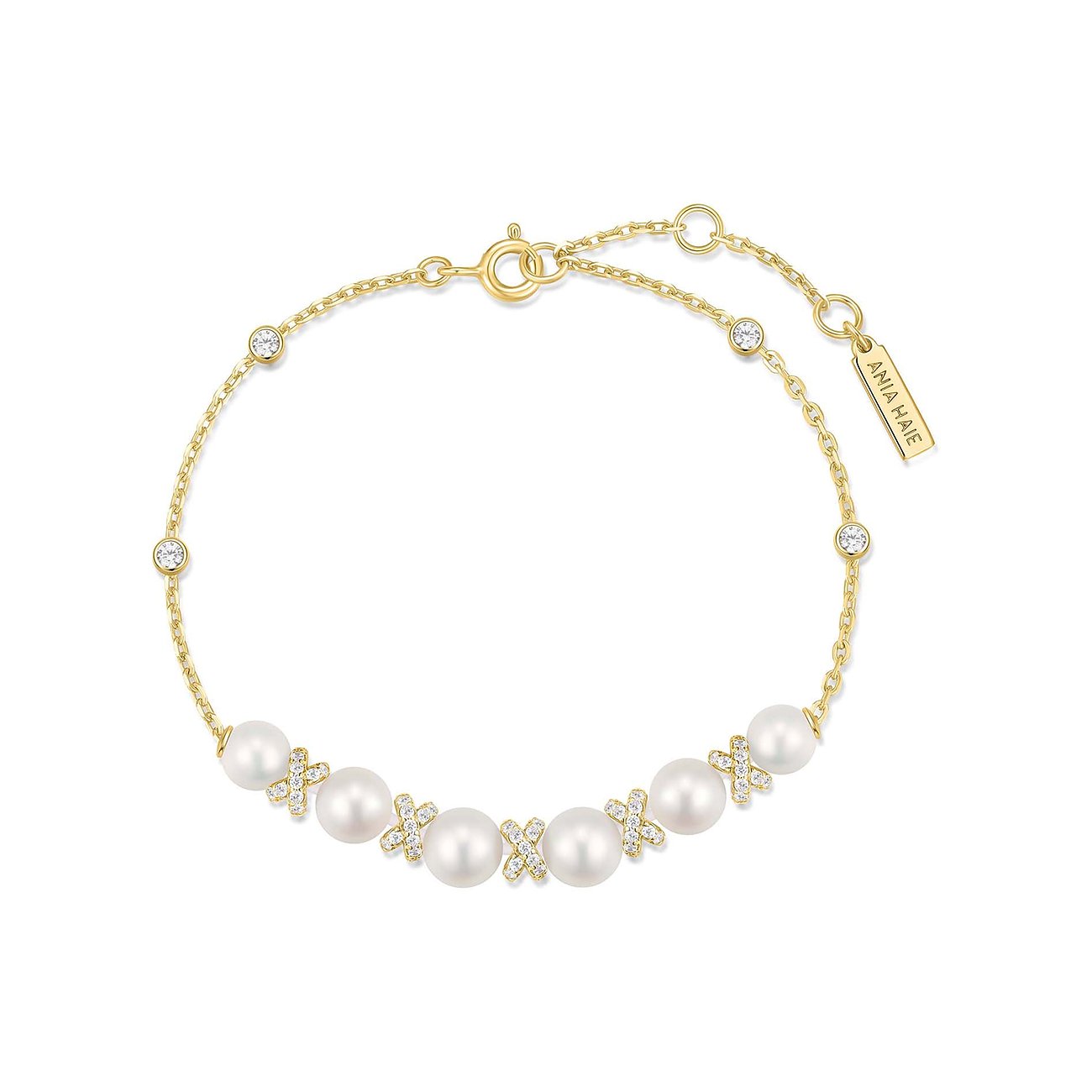 Ania Haie Armband aus goldenem Silber mit weißen Perlen und funkelnden Zirkonia-Akzenten, komplett mit Marken-Anhänger.