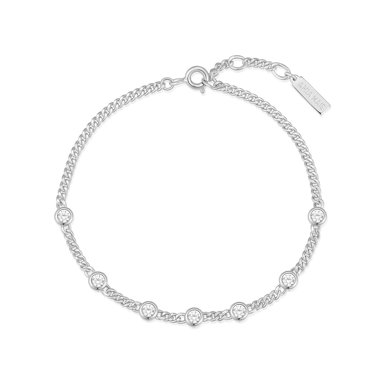Ania Haie Armschmuck aus Silber, ein Kettenarmband mit sechs glänzenden, runden Zirkonia im Krappenfassung.