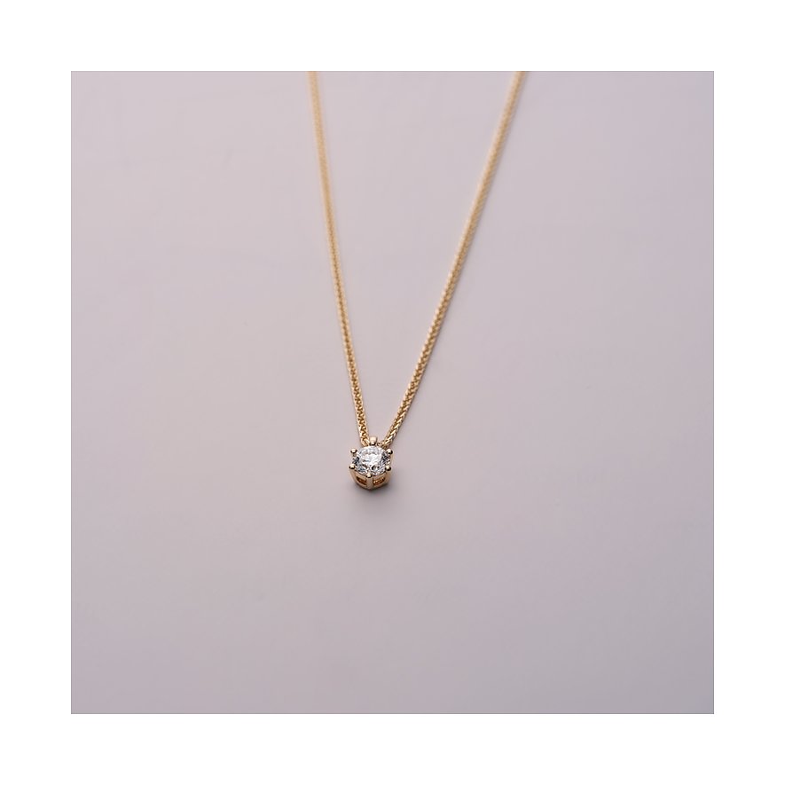 Eine CHRIST Gelbgold 585 Halskette mit einem strahlenden Diamant-Anhänger, auf einem neutralen Hintergrund.