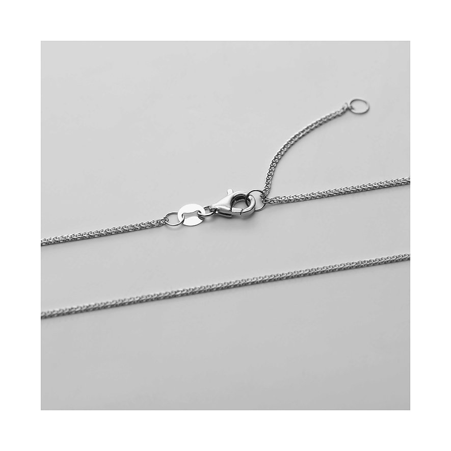 Nahaufnahme der Schließe einer Weißgoldkette des CHRIST Halsschmucks, die auf einem grauen Hintergrund liegt.