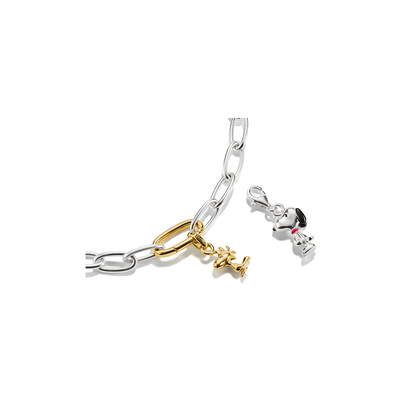 Thomas Sabo Anhängerschmuck: goldene Lucy-Figur an Gliederkette, Snoopy-Anhänger in Silber und Emaille.