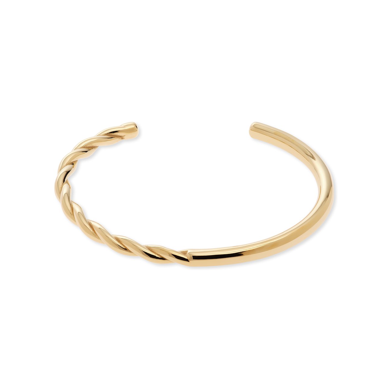 Un bracelet Guido Maria Kretschmer en acier inoxydable doré, un côté torsadé, l'autre lisse.
