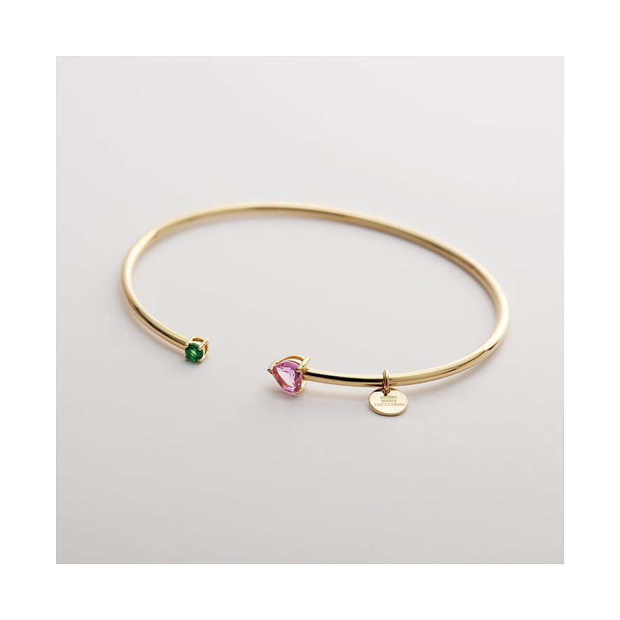 Das Guido Maria Kretschmer Armband aus recyceltem Silber ist mit einem grünen und einem pinken Zirkonia-Farbstein besetzt.