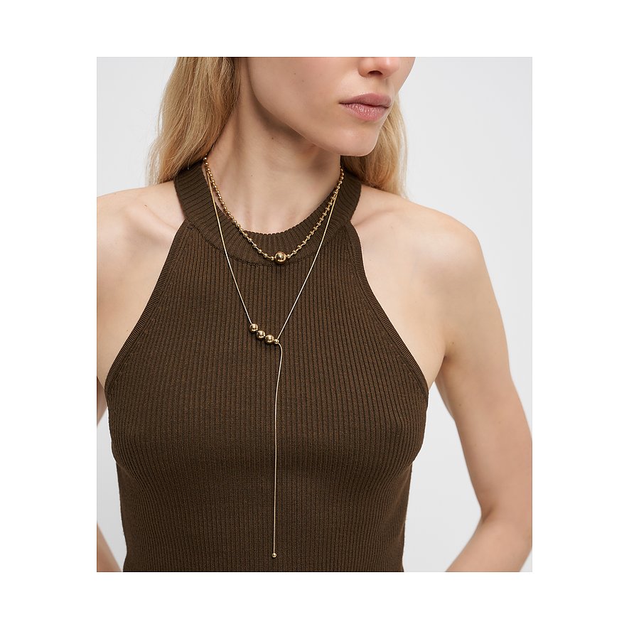 Collier Liebeskind ajusté en acier inoxydable doré avec une sphère, porté par un mannequin.