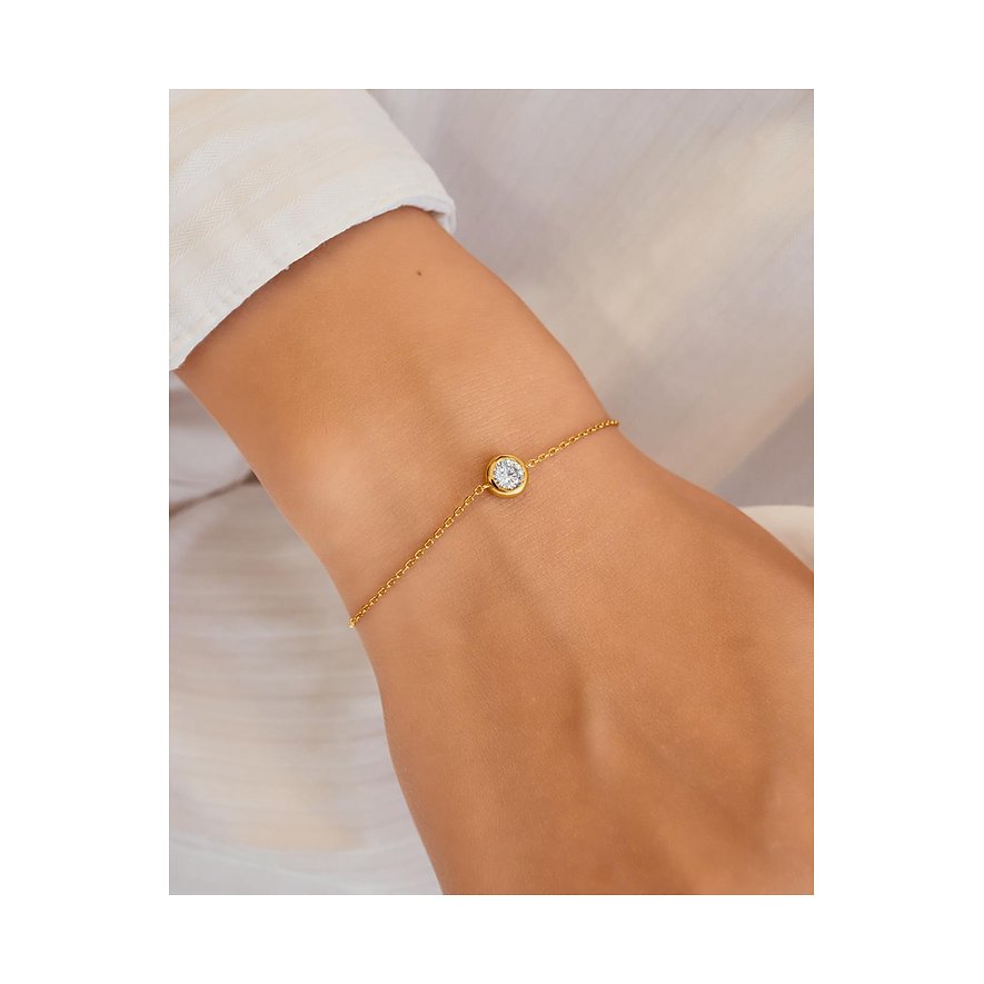 Bracelet Ania Haie en argent avec un zircone coloré rond unique, porté au poignet d'une femme.