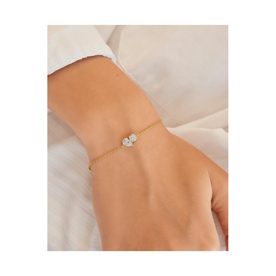 Ania Haie Armband aus vergoldetem Silber mit drei klaren Zirkonia-Schmucksteinen in runder und tropfenförmiger Fassung.