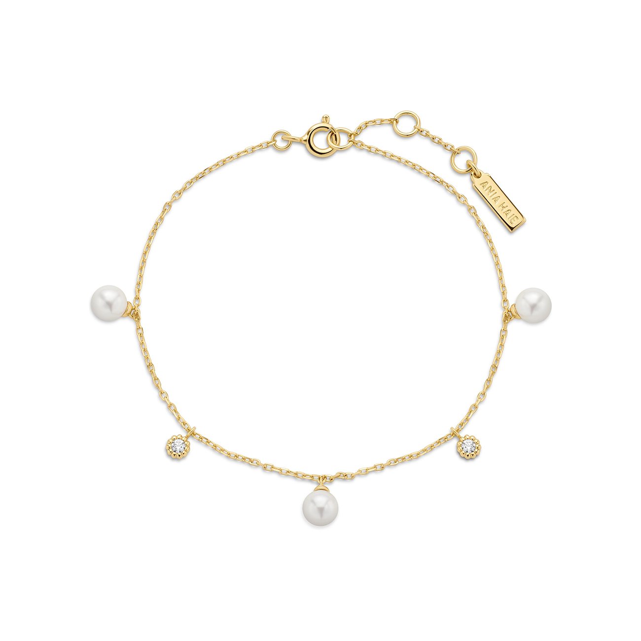 Ania Haie Armband aus vergoldetem Silber mit fünf Perlenanhängern und zwei Zirkonia-Verzierungen.