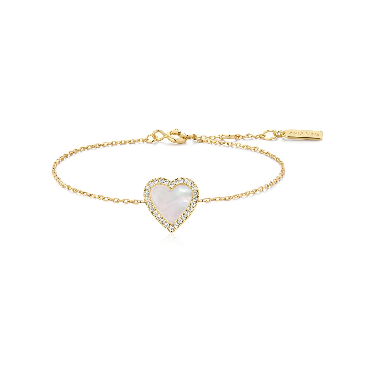 Bracelet Ania Haie en argent plaqué or avec un insert de nacre en forme de cœur, entouré de zircones.
