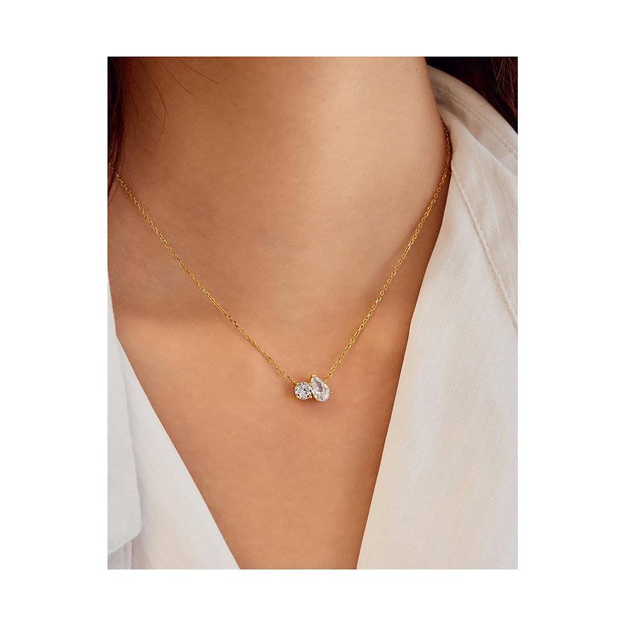 Collier Ania Haie en argent plaqué or, avec deux pendentifs zircones serrés, porté autour d'un cou.
