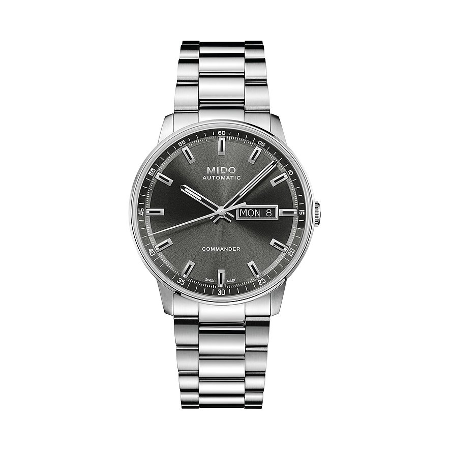 Die Mido Commander Herrenuhr aus Edelstahl zeigt ein graues Zifferblatt mit Datumsanzeige und silbernen Indizes.
