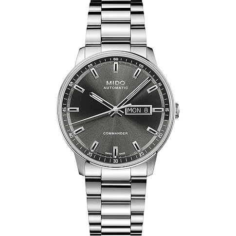 Die Mido Commander Herrenuhr aus Edelstahl zeigt ein graues Zifferblatt mit Datumsanzeige und silbernen Indizes.