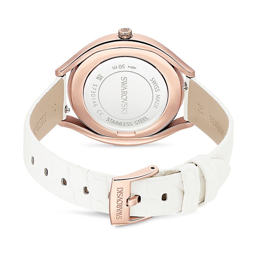 Die Rückseite einer Swarovski Unisexuhr aus Edelstahl mit roségoldfarbender Lünette und weißem Lederarmband.