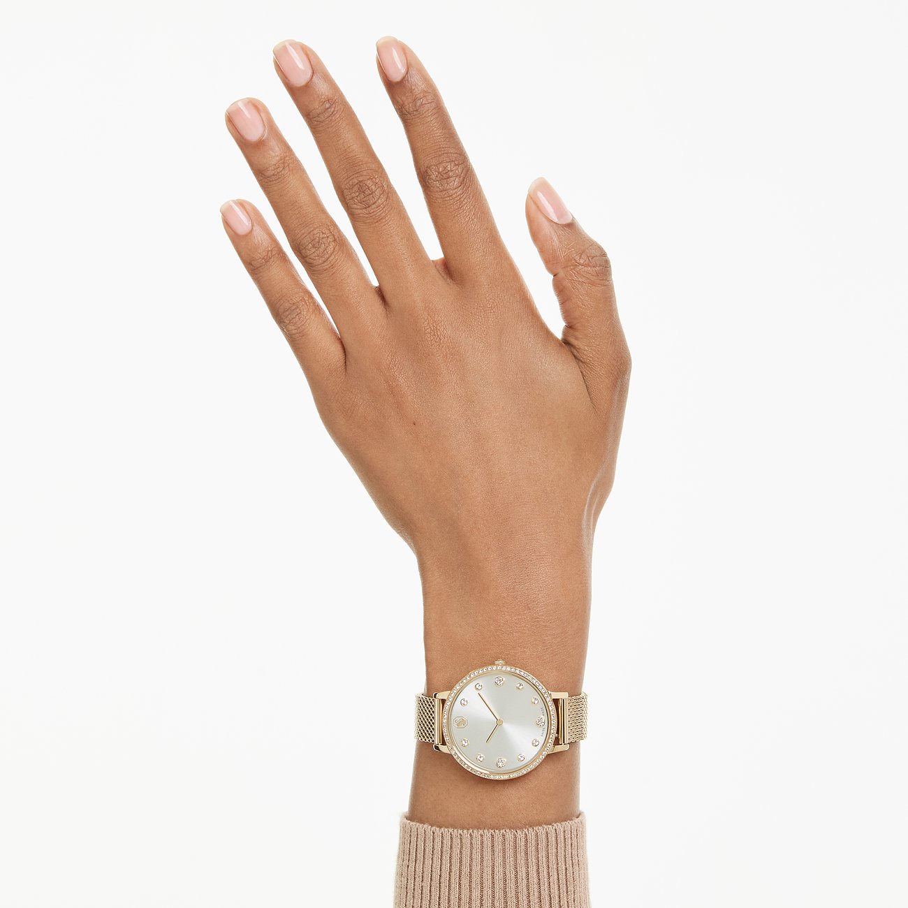 Am Handgelenk getragene goldene Swarovski Unisexuhr aus Edelstahl mit farbigen Kristallen.