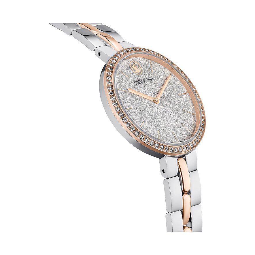 Nahaufnahme einer Swarovski Unisexuhr aus Edelstahl und Roségold. Das Zifferblatt ist mit Swarovski-Kristallen besetzt.