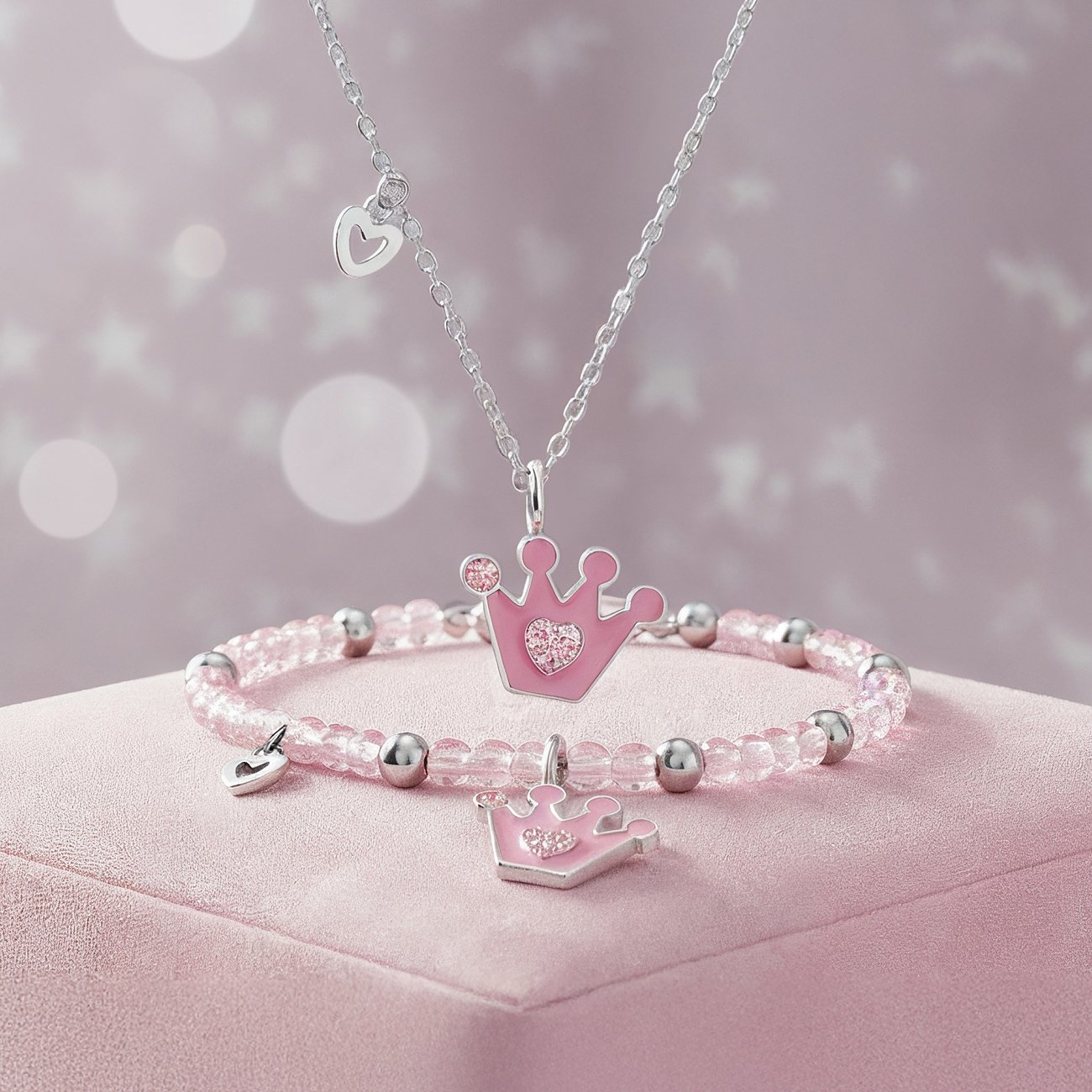 Engelsrufer sieradenset: Halsketting & armband van glanzend RVS & roze email. Kroon- & hartbedels.