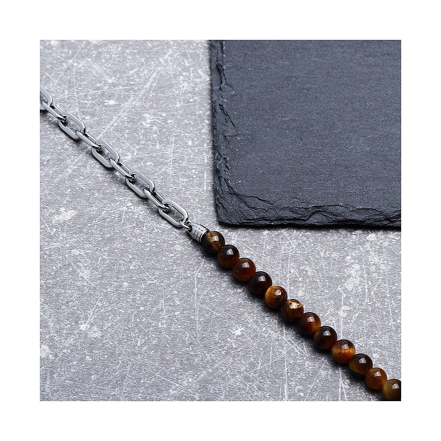 Morellato-armbandet i rostfritt stål och tigeröga, tillverkat av en kedja och bruna pärlor, ligger på grå bakgrund.