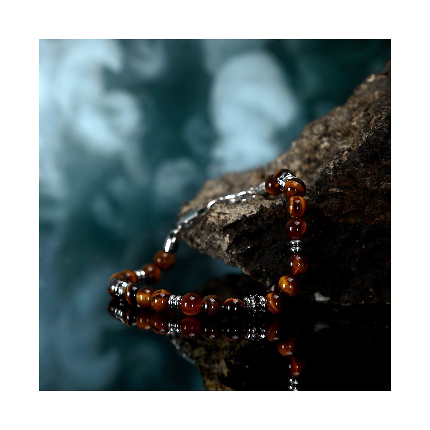 Morellato Edelstahlarmband mit dunkelbraunen Tigerauge-Farbsteinen und silberfarbenen Details auf Felsen, reflektiert.