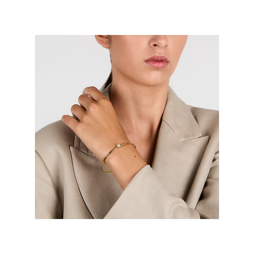 Un delicato, raffinato bracciale Morellato in acciaio inossidabile color oro con un singolo zircone rotondo al polso.