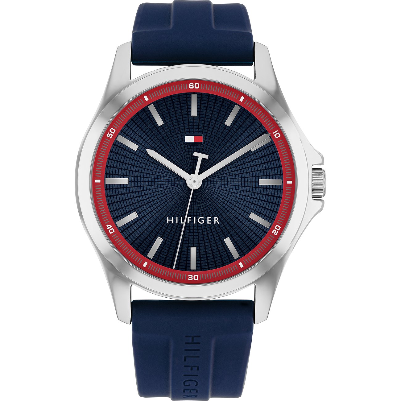 Tommy Hilfiger herenhorloge: zilverkleurig RVS, donkerblauwe siliconen band, blauwe wijzerplaat met rode accenten.