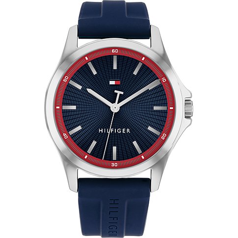 Tommy Hilfiger Herrenuhr: silberfarbener Edelstahl, dunkelblaues Silikonarmband, blaues Zifferblatt mit roten Akzenten.