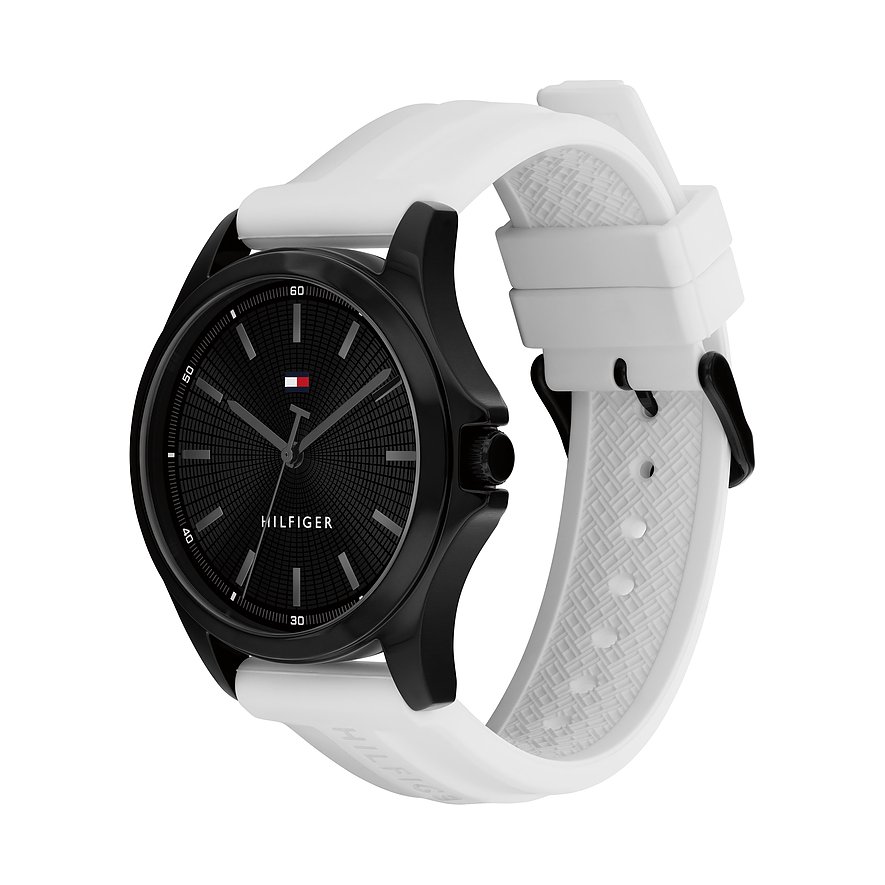 Een zwart Tommy Hilfiger herenhorloge van roestvrij staal met witte siliconen band en zwarte wijzerplaat.